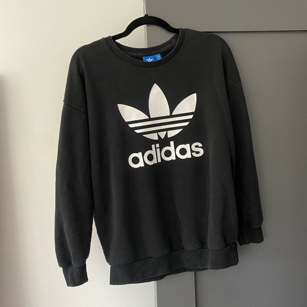 Likely worn black Adidas sweater! Not the stiff kind.